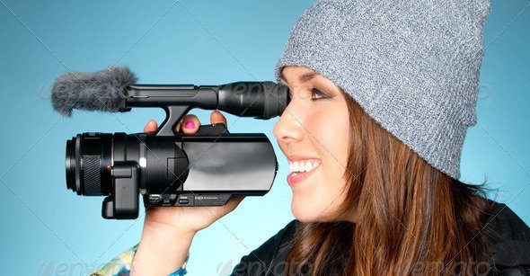 Hip Young Adult Female Points Video Camera