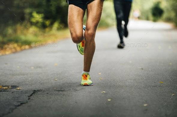 leader of marathon young athlete runner